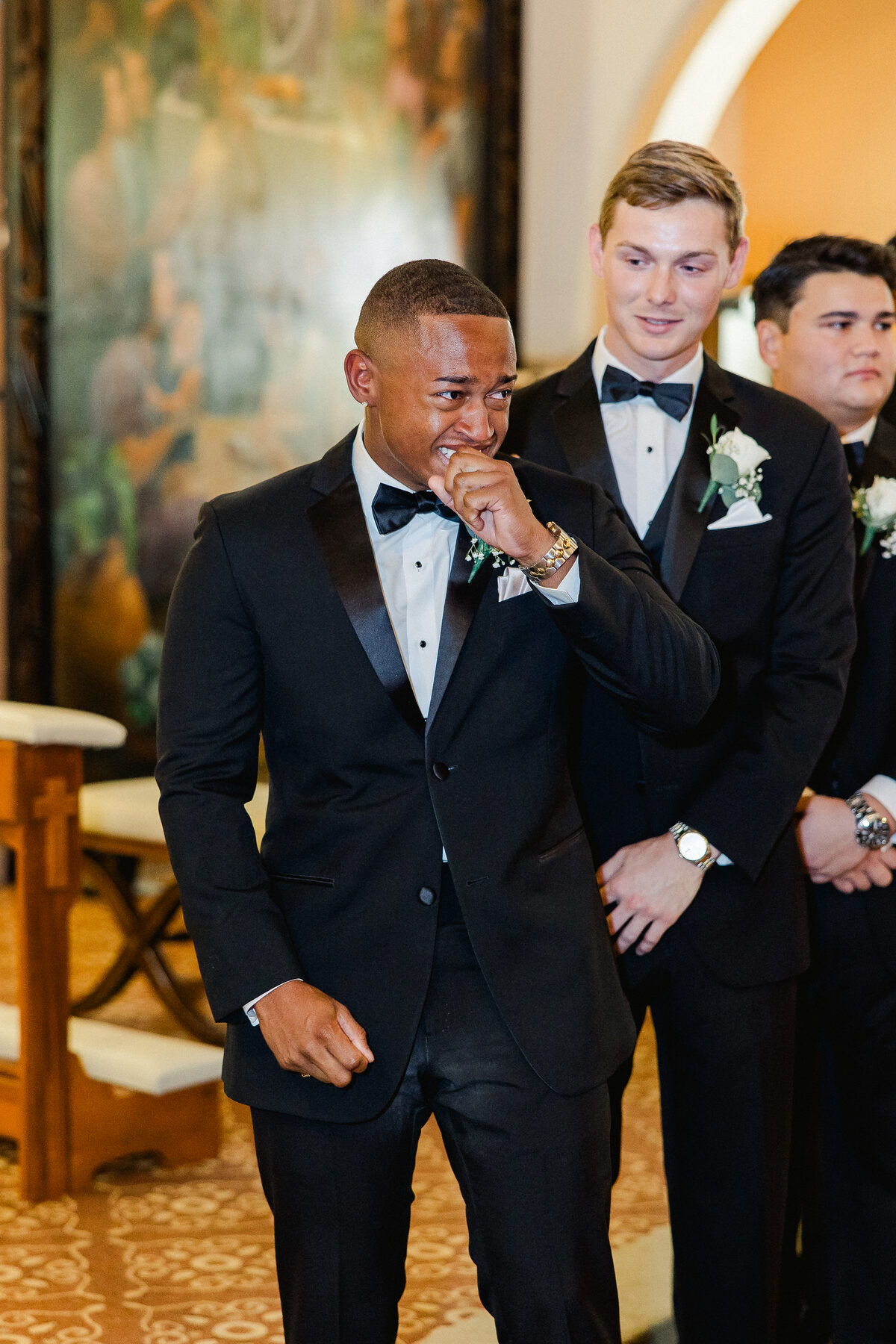 Groom overcome with emotion at the altar as his bride walks toward him at Hotel Haya in Tampa — luxury wedding photographer Ailyn La Torre